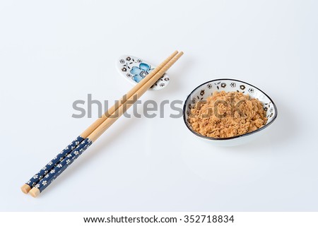pork floss in the plate with chopsticks on white background Royalty-Free Stock Photo #352718834