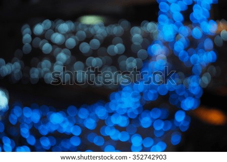 Colorful christmas tree lights with bokeh in garden  