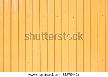 Close up vertical line of yellow metal sheet, Industrial material.