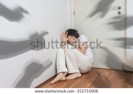 Many hands pointing at paranoid and schizophrenic frightened man Royalty-Free Stock Photo #352755008