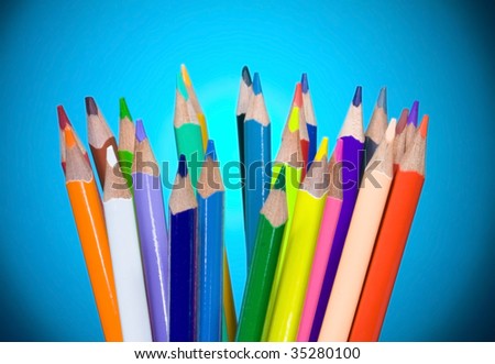 Colour pencils on blue background