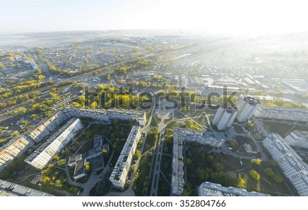 Aerial city view with crossroads, roads, houses, buildings, parks and parking lots, bridges. Copter shot. Panoramic image.