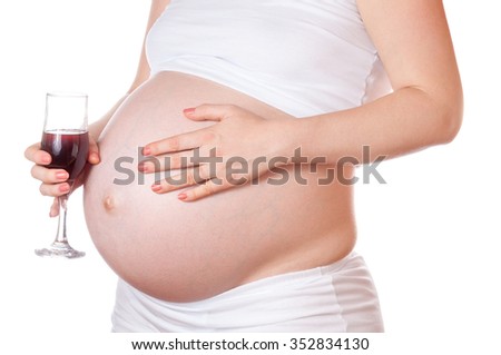 Pregnant woman with glass of wine in hand