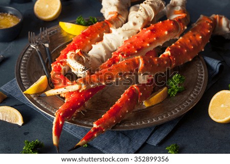 Cooked Organic Alaskan King Crab Legs with Butter Royalty-Free Stock Photo #352899356