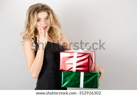woman with presents in a black dress