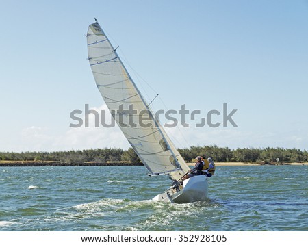 Monohull sailing boat competing in race on the Burnett River Bundaberg staged by the Bundaberg Sailing Club.  Queensland - Australia

 Royalty-Free Stock Photo #352928105