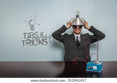 Vintage businessman concept wearing futuristic helmet at office 