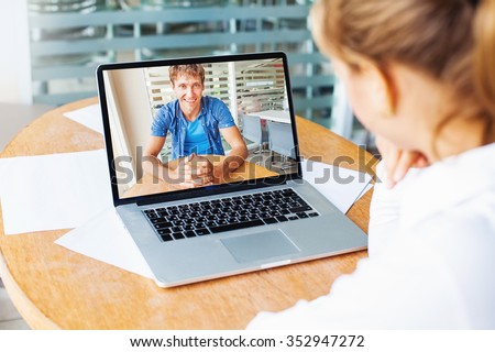 video call. woman and man talking on web camera in office Royalty-Free Stock Photo #352947272