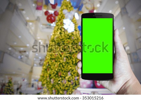 Modern mobile phone in the hand,on blur background image 