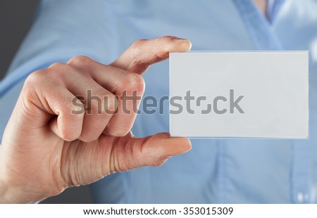 Businesswoman's hand showing business card