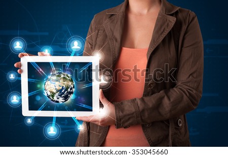 Young woman presenting 3d earth globe in modern tablet