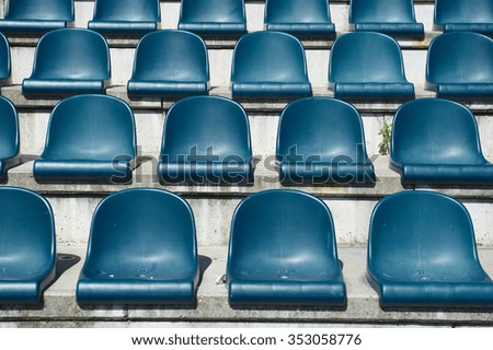 plastic blue seats on stadium