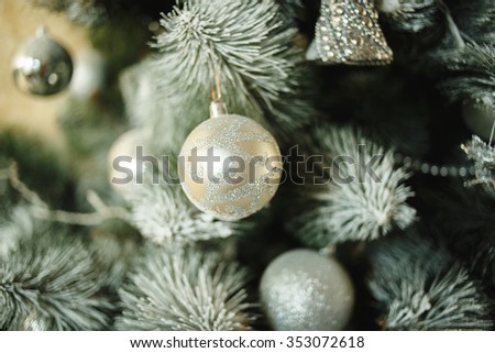 close up of christmas tree decorated with balls