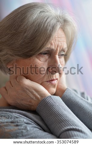 Portrait of thinking elderly woman, close up