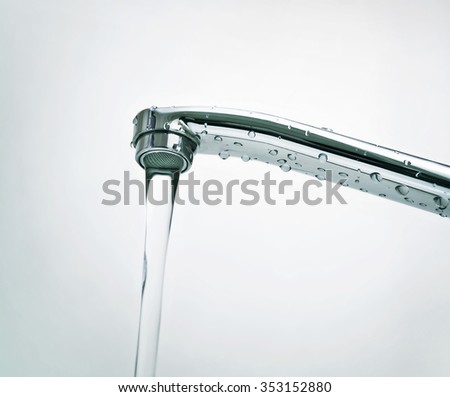 opened water tap Royalty-Free Stock Photo #353152880