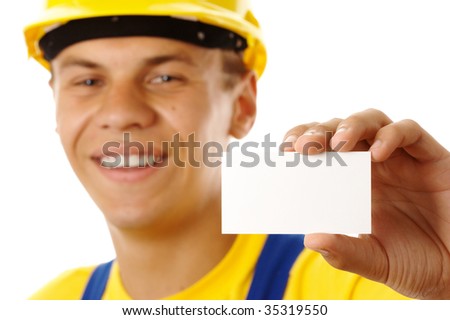 Worker showing his business card and smile, isolated over white