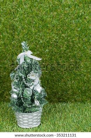 Silver Christmas tree on green background