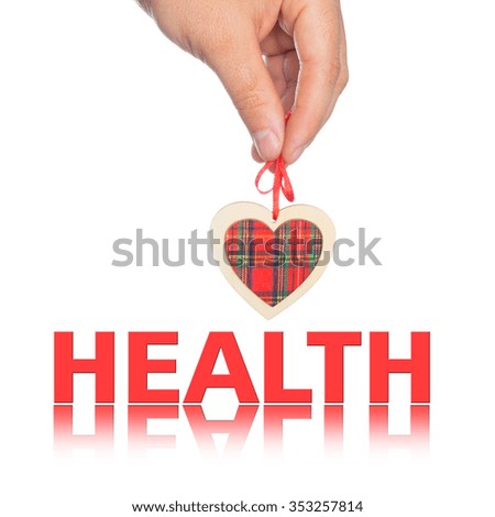 hand with  heart and  word health on the background.