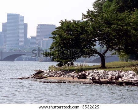 a scenic shot of the Potomac River with a Washington, DC city park and the Roslyn, Va. skyline in the background