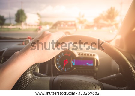 Vintage toned picture of driving while sunshine prod eye.
