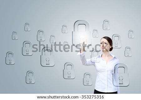 Attractive businesswoman touching with finger media lock icon 