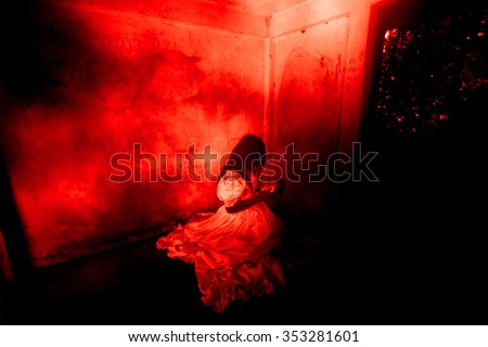Haunted Doll,Ghost in Haunted House,Mysterious Woman in White Dress Sitting in Abandon Building,Horror Background For Halloween Concept and Book Cover Ideas 