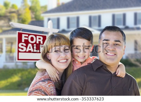 Happy Young Mixed Race Family in Front of For Sale Real Estate Sign and New House.