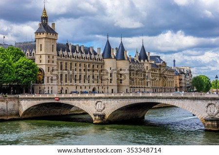 Castle Conciergerie - former royal palace and prison. Conciergerie located on the west of the Cite Island and today it is part of larger complex known as Palais de Justice. Paris, France.  Royalty-Free Stock Photo #353348714