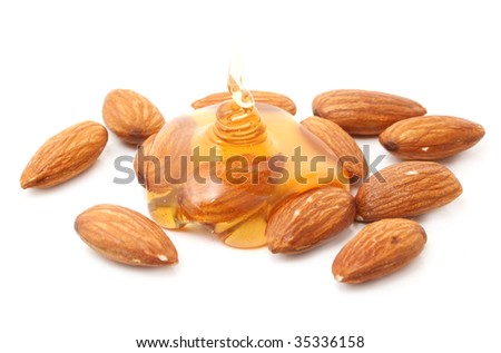 almond with honey isolated on white