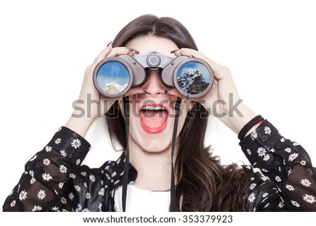 Girl portrait looking at mountains through binoculars