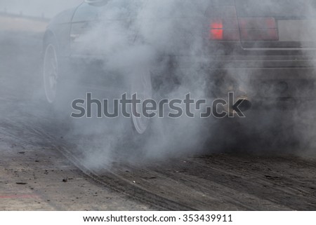 sport car wheel drifting and smoking on track
