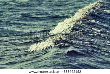 sea wave close up, low angle view, cross processing effect