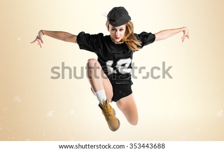 Woman dancing street dance and jumping