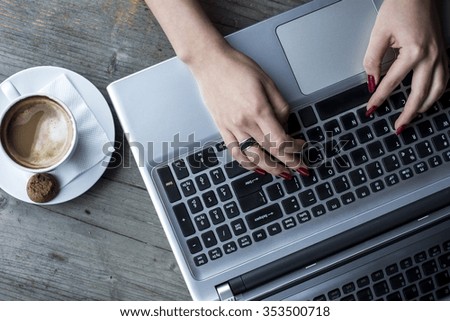 Woman's hand on the keyboard 