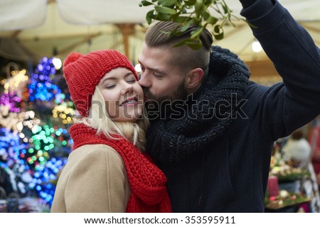 Kissing under the mistletoe is a tradition