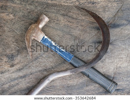 The hammer and the sickle communist symbol on wood background