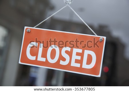 Orange Closed Sign on Shop Door