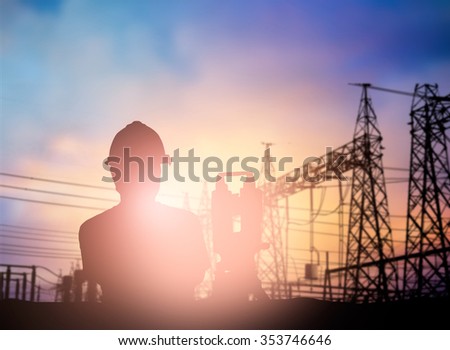silhouette survey engineer working  in a building site over Blurred construction worker on construction site