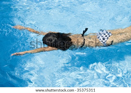 Woman Swimming in the Pool