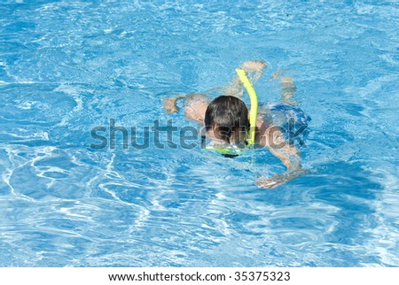 Man Snorkeling in the Swimming Pool
