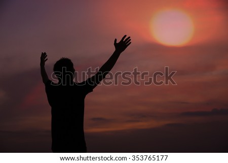happy silhouette man embrace sky