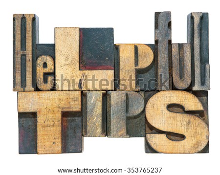 helpful tips phrase made from mixed wooden letterpress type isolated on white