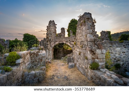 Ruins of Stari Bar ancient fortress, arch way to ruined defense tower, Montenegro. Royalty-Free Stock Photo #353778689