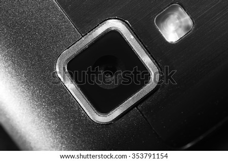 Web camera and flash your mobile phone. Close up view fragment metal back cover device. Instagram camera. Black and white toning.