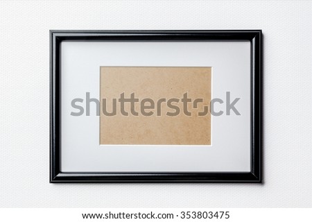 Black plain empty thin wood picture frame with white mat passe-partout on white bricks background