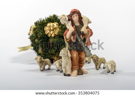 Shepherd with his sheep, element of the Christmas nativity. White background with the Christmas decorations / Shepherd with his sheep