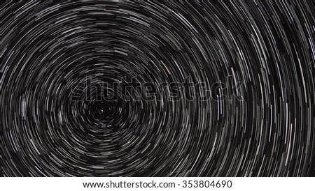 Startrails. Black and white star tails on the sky. Circular startrails. Startrails background. Polar star shot on long exposure. 