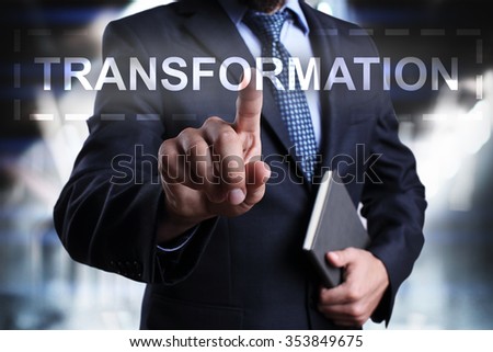 Businessman pressing button on touch screen interface and select "Transformation". Business concept. Internet concept.