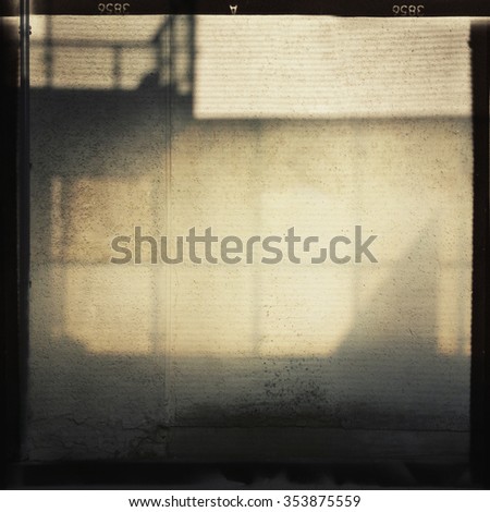 Abstract film background. Shadows on the wall. Contains soft grain.