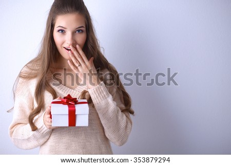 Young woman happy smile hold gift box in hands